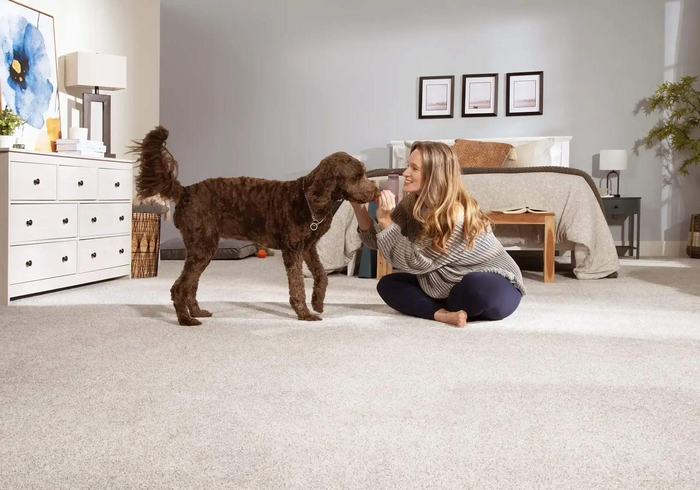 Happy lady playing with dog